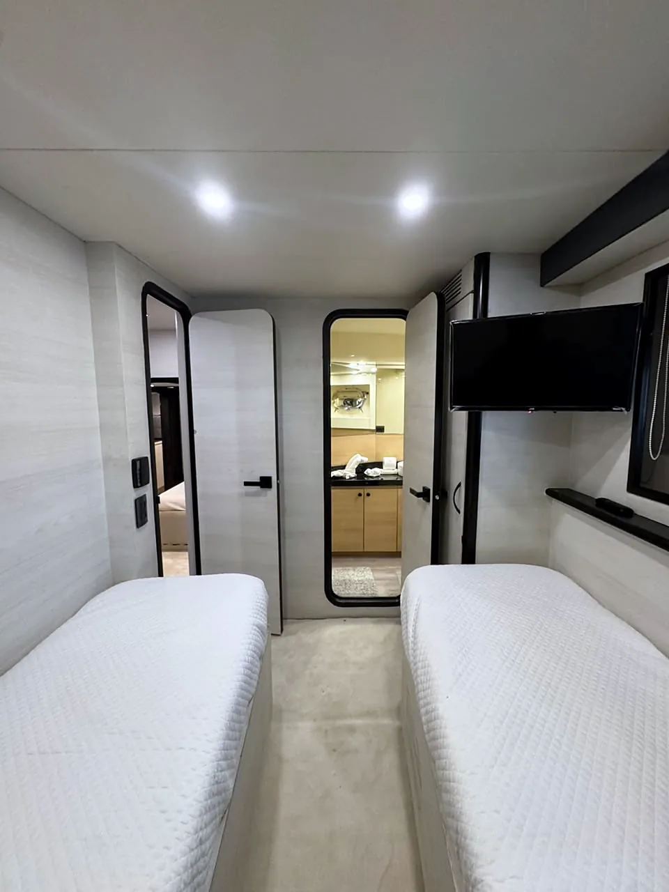 Twin-bed stateroom looking toward the bathroom