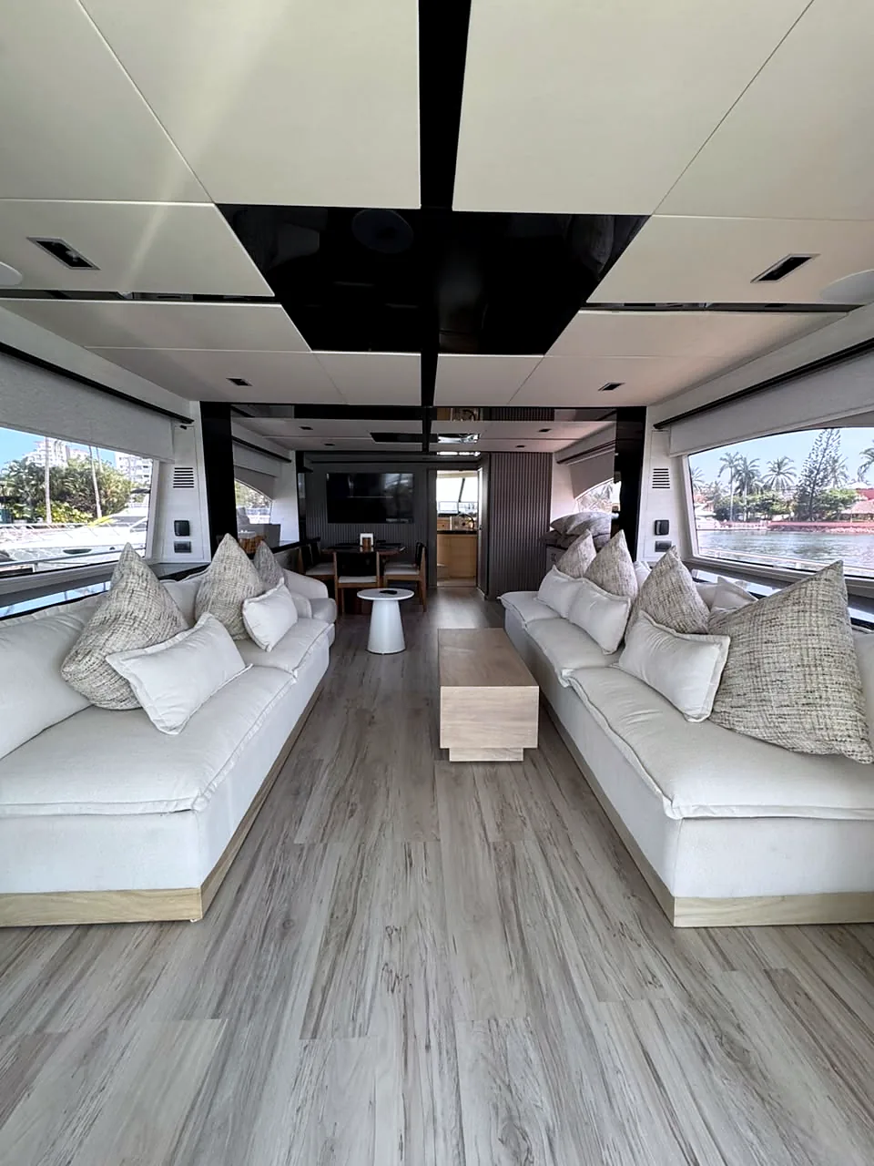 Main salon with facing sofas and wide windows