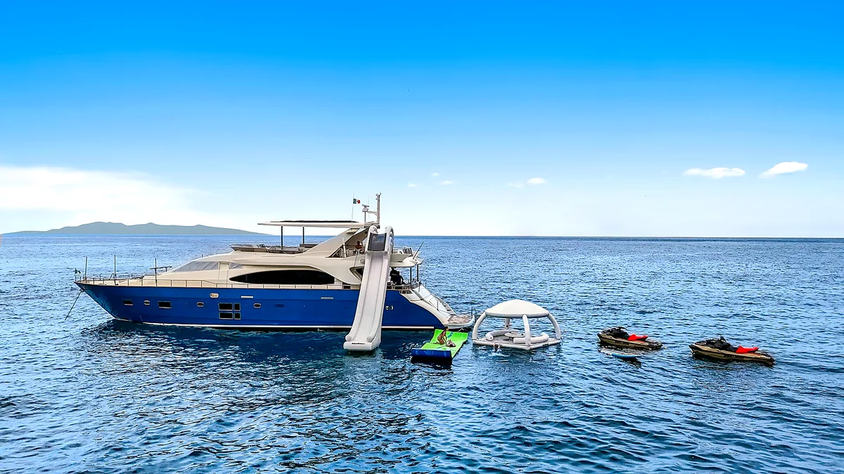 MÍO yacht with slide and toys on the water